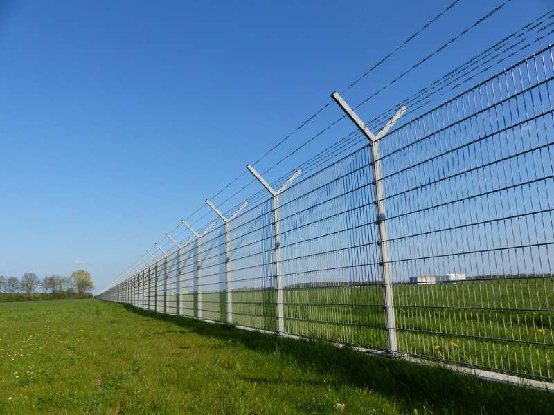 Electric Fence with Barbed Wire